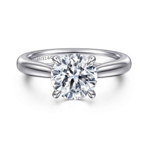 Gabriel & Co. ER17023R8PTJJJ platinum Contemporary engagement ring, front view of a round center held by teardrop tipped prongs above a smooth tapered band