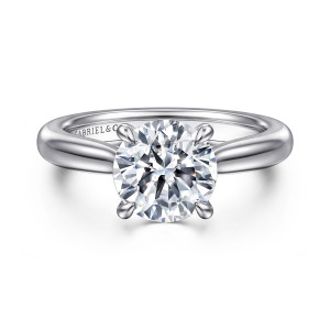 Gabriel & Co. ER17023R8W4JJJ 14 karat white gold Contemporary engagement ring, front view of a round center held by slim prongs with teardrop shaped tips