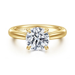 Gabriel & Co. ER17023R8Y4JJJ 14 karat yellow gold Contemporary engagement ring, front view of a round center held by four teardrop tipped prongs above a smooth tapered band