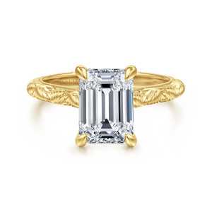 Gabriel & Co. ER17029E10Y4JJJ 14 karat yellow gold Victorian engagement ring, front view of an upright emerald cut center with rounded prongs above engraved shoulders