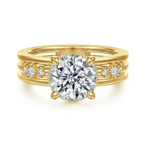 Gabriel & Co. ER17035R8Y44JJ 14 karat yellow gold Contemporary engagement ring, front view of a round center in four prongs between rails with small diamonds on the middle one