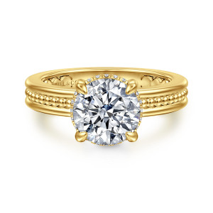 Gabriel & Co. ER17036R8Y44JJ 14 karat yellow gold Bujukan engagement ring, front view of a round center in four prongs with a beaded channel across the band