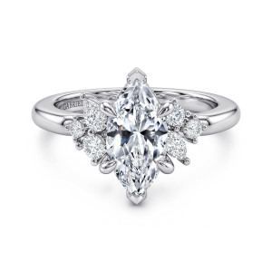 Gabriel & Co. ER17072M6W44JJ 14 karat white gold Starlight engagement ring, front view of a marquise center with pointed end prongs between staggered stone clusters