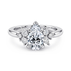 Gabriel & Co. ER17072P6W44JJ 14 karat white gold Starlight engagement ring, front view of the pear shaped center with its capped point and unmatched clusters on each shoulder