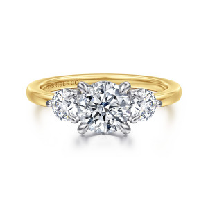 Gabriel & Co. ER17083R4M44JJ 14 karat white and yellow gold Contemporary engagement ring, front view of a round center flanked by two smaller round side diamonds in rounded prongs