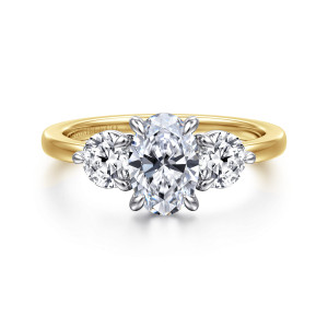 Gabriel & Co. ER17084O4M44JJ 14 karat white and yellow gold Contemporary engagement ring, front view of an oval center between round side stones on a plain smooth band