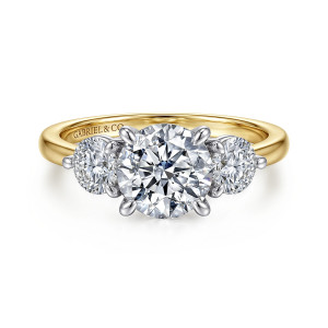 Gabriel & Co. ER17084R6M44JJ 14 karat white and yellow gold Contemporary engagement ring, front view of a round center between two round side stones over a warm toned band