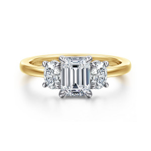 Gabriel & Co. ER17085E4M44JJ 14 karat white and yellow gold Contemporary engagement ring, front view of an emerald cut center between two oval stones on a smooth band