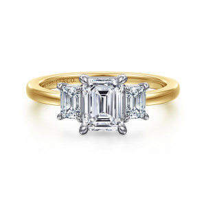 Gabriel & Co. ER17087E4M43JJ 14 karat white and yellow gold Contemporary engagement ring, front view of an emerald cut center with a step cut stone on each side