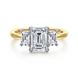 Gabriel & Co. ER17088E6M43JJ 14 karat white and yellow gold Contemporary engagement ring, front view of the emerald cut center flanked by step cut side stones, each held by claw prongs