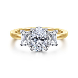 Gabriel & Co. ER17088O4M43JJ 14 karat white and yellow gold Contemporary engagement ring, front view of an upright oval center between step cut side stones on a slim smooth band