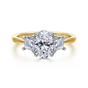 Gabriel & Co. ER17089O4M43JJ 14 karat white and yellow gold Contemporary engagement ring, front view of the oval center with a tapered trapezoid stone on each side