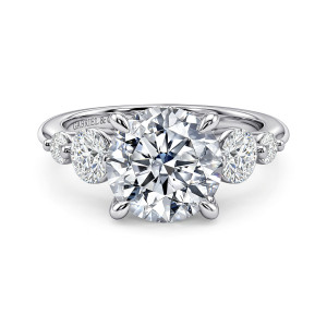 Gabriel & Co. ER17097R12W44JJ 14 karat white gold Contemporary engagement ring, front view of a round center flanked by a larger and a smaller round stone on each side