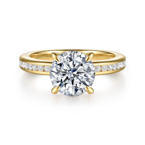 Gabriel & Co. ER17100R8Y44JJ 14 karat yellow gold Classic engagement ring, front view of a round center between four tapered prongs above channel set shoulders