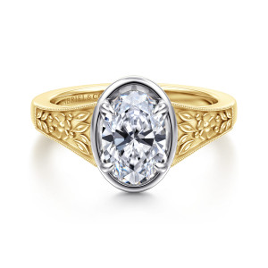 Gabriel & Co. ER17137O6M4JJJ 14 karat white and yellow gold Victorian engagement ring, front view of an oval center in a smooth collar between carved flower and leaf shoulders