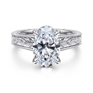 Gabriel & Co. ER17138O12W4JJJ 14 karat white gold Victorian engagement ring, front view of the oval center in four claws above a band engraved with feather leaves