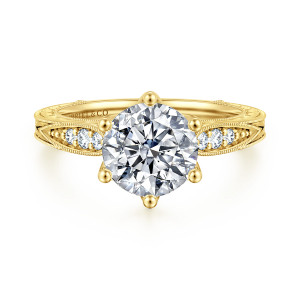 Gabriel & Co. ER17140R8Y44JJ 14 karat yellow gold Victorian engagement ring, front view of a round center held by six ball tipped prongs above small shoulder diamonds