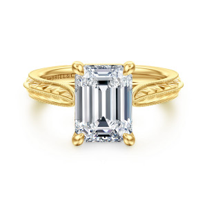 Gabriel & Co. ER17147E12Y4JJJ 14 karat yellow gold Victorian engagement ring, front view of the emerald cut center in four rounded prongs with engraved shoulders beside it