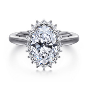 Gabriel & Co. ER17190O12W44JJ 14 karat white gold Contemporary engagement ring, front view of an oval center inside a halo whose small diamonds each end in tiny points