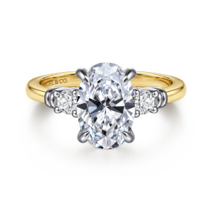 Gabriel & Co. ER17407O8M44JJ 14 karat white and yellow gold Contemporary engagement ring, front view of the oval center held by four claws with a round diamond on each side