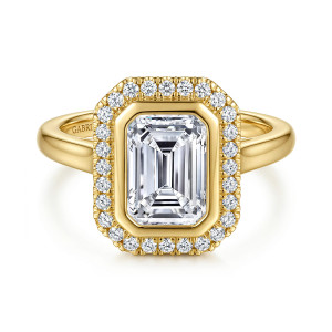Gabriel & Co. ER17409E8Y44JJ 14 karat yellow gold Contemporary engagement ring, front view of a clipped corner diamond frame around a smooth bezel and an emerald cut center