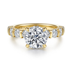 Gabriel & Co. ER17417R8Y44JJ 14 karat yellow gold Contemporary engagement ring, front view of a round center with large round diamonds between slim bars on each shoulder