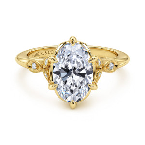 Gabriel & Co. ER17430O8Y44JJ 14 karat yellow gold Victorian engagement ring, front view of an oval center with teardrop tipped prongs between beaded leaf settings
