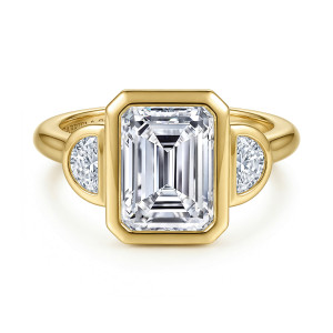 Gabriel & Co. ER17432E12Y43JJ 14 karat yellow gold Lotus engagement ring, front view of a clipped corner bezel around an emerald cut center between half moons