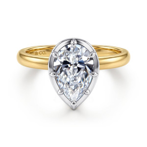 Gabriel & Co. ER17436P8M4JJJ 14 karat white and yellow gold Contemporary engagement ring, front view of a pear shaped center in a flat rim edged with small pointed prongs