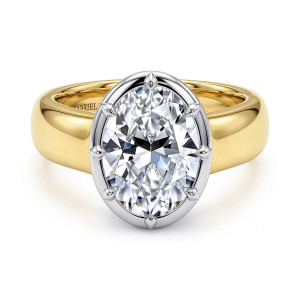 Gabriel & Co. ER17437O12M4JJJ 14 karat white and yellow gold Contemporary engagement ring, front view of an oval center inside a smooth rim with pointed tips around it