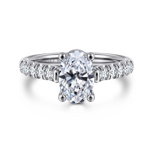 Gabriel & Co. ER7016O6W44JJ 14 karat white gold Classic engagement ring, front view of an oval center in four ball tipped prongs between diamond lined shoulders