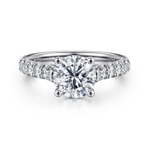 Gabriel & Co. ER7016R6W44JJ 14 karat white gold Classic engagement ring, front view of a round center held by ball tipped prongs above shared prong diamonds on the shoulders