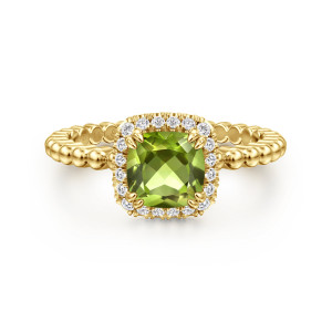 Gabriel & Co. LR50890Y45PE 14 karat yellow gold Color ring, front view of the green cushion shaped stone, its diamond frame and the beaded shoulders