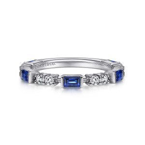 Gabriel & Co. LR51707W45SA 14 karat white gold Stackable ring, front view of a blue baguette shaped stone between pairs of round diamonds in prongs