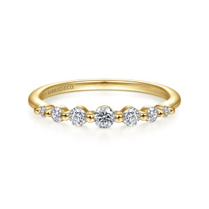 Gabriel & Co. LR51740Y45JJ 14 karat yellow gold Stackable ring, front view of round diamonds falling away from a larger middle stone between metal beads