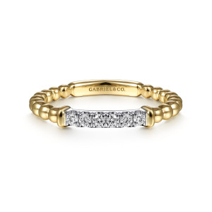 Gabriel & Co. LR51786M45JJ 14 karat white and yellow gold Bujukan ring, front view of the diamond bar between polished caps with a maker's mark on the flat plate behind