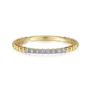 Gabriel & Co. LR51823Y45JJ 14 karat yellow gold Bujukan ring, front view of the polished metal beads and the short row of stones across the top