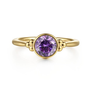 Gabriel & Co. LR52244Y4JAM 14 karat yellow gold Bujukan ring, front view of the round bezel set stone with a bead cluster on each side