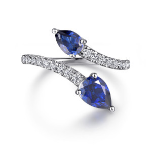 Gabriel & Co. LR52401W45SA 14 karat white gold Color ring, front view of two blue pear shaped stones in prongs at the passing ends