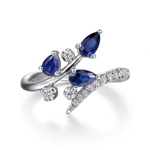 Gabriel & Co. LR52408W45SA 14 karat white gold Color ring, top view of three blue pear stones along a twig beside a tapering diamond strand