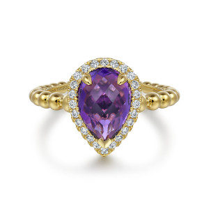 Gabriel & Co. LR52524Y45AM 14 karat yellow gold Bujukan ring, front view of the pear shaped violet stone, its pointed end and the halo of diamonds