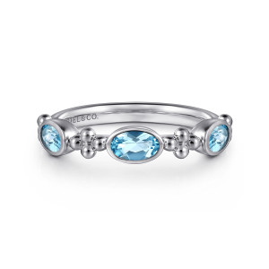 Gabriel & Co. LR52643SVJBT sterling silver Bujukan ring, front view of a light blue oval stone in a bezel flanked by bead clusters and end stones