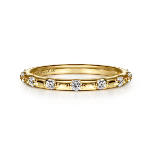 Gabriel & Co. LR52667Y45JJ 14 karat yellow gold Contemporary ring, front view of diamonds flanked by metal bead pairs on a smooth polished band