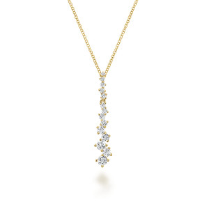 Gabriel & Co. NK4970Y44JJ 14 karat yellow gold Lusso necklace, front view of a vertical drop of staggered prong set diamonds growing larger downward