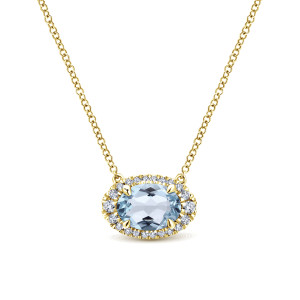 Gabriel & Co. NK5312Y45AQ 14 karat yellow gold Color necklace, front view of the sideways oval blue stone, its corner prongs and the diamond halo