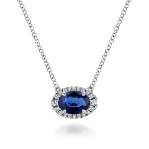 Gabriel & Co. NK5385W45SA 14 karat white gold Color necklace, front view of the deep blue oval with its four claws and ring of small diamonds