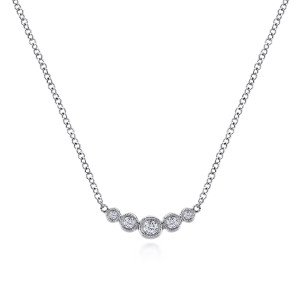 Gabriel & Co. NK5424W45JJ 14 karat white gold Lusso necklace, front view of the curved bar of graduated bezel stones joined to the chain