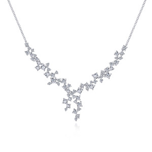 Gabriel & Co. NK5656W84JJ 18 karat white gold Waterfall necklace, front view of scattered prong set diamond clusters dipping to an uneven cascade