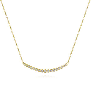 Gabriel & Co. NK5796Y45JJ 14 karat yellow gold Lusso necklace, front view of the curved bar of bezel set diamonds growing bigger toward the middle