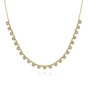 Gabriel & Co. NK6024Y45JJ 14 karat yellow gold Lusso necklace, front view of round stones in bezels with textured rims hanging from the curve